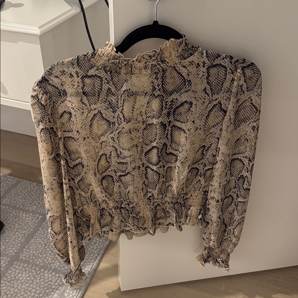 Snake Print Top with Ruffle Detail. New with tags never worn before!!